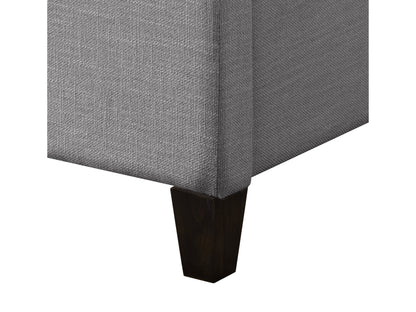 Grey upholstered queen bed with tufted headboard, soft fabric finish, and sturdy wooden legs. Ideal for modern bedrooms seeking comfort and style.