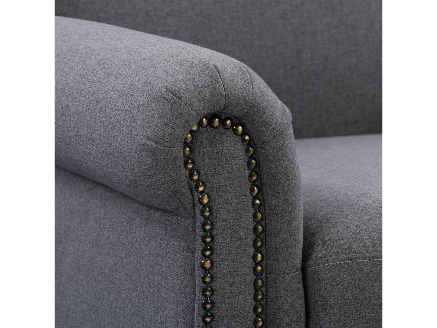 Grey armchair with plush upholstery, sleek wooden legs, and tufted backrest. The chair features a modern design with comfortable armrests, perfect for living rooms or offices.