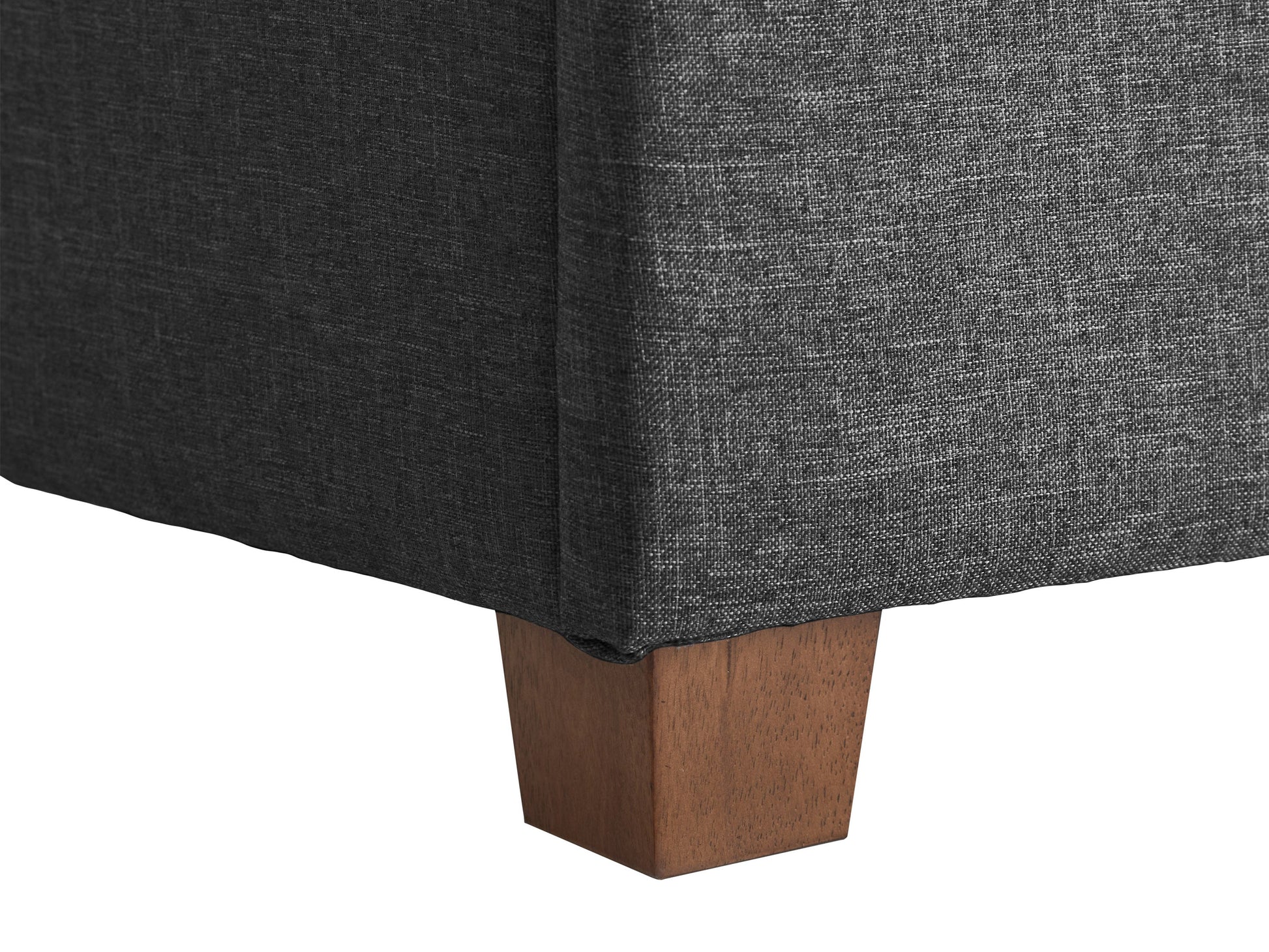Dark grey large storage ottoman with tufted top, soft fabric upholstery, and spacious interior storage compartment. Ideal for living room, bedroom, or entryway as a stylish and functional furniture piece.