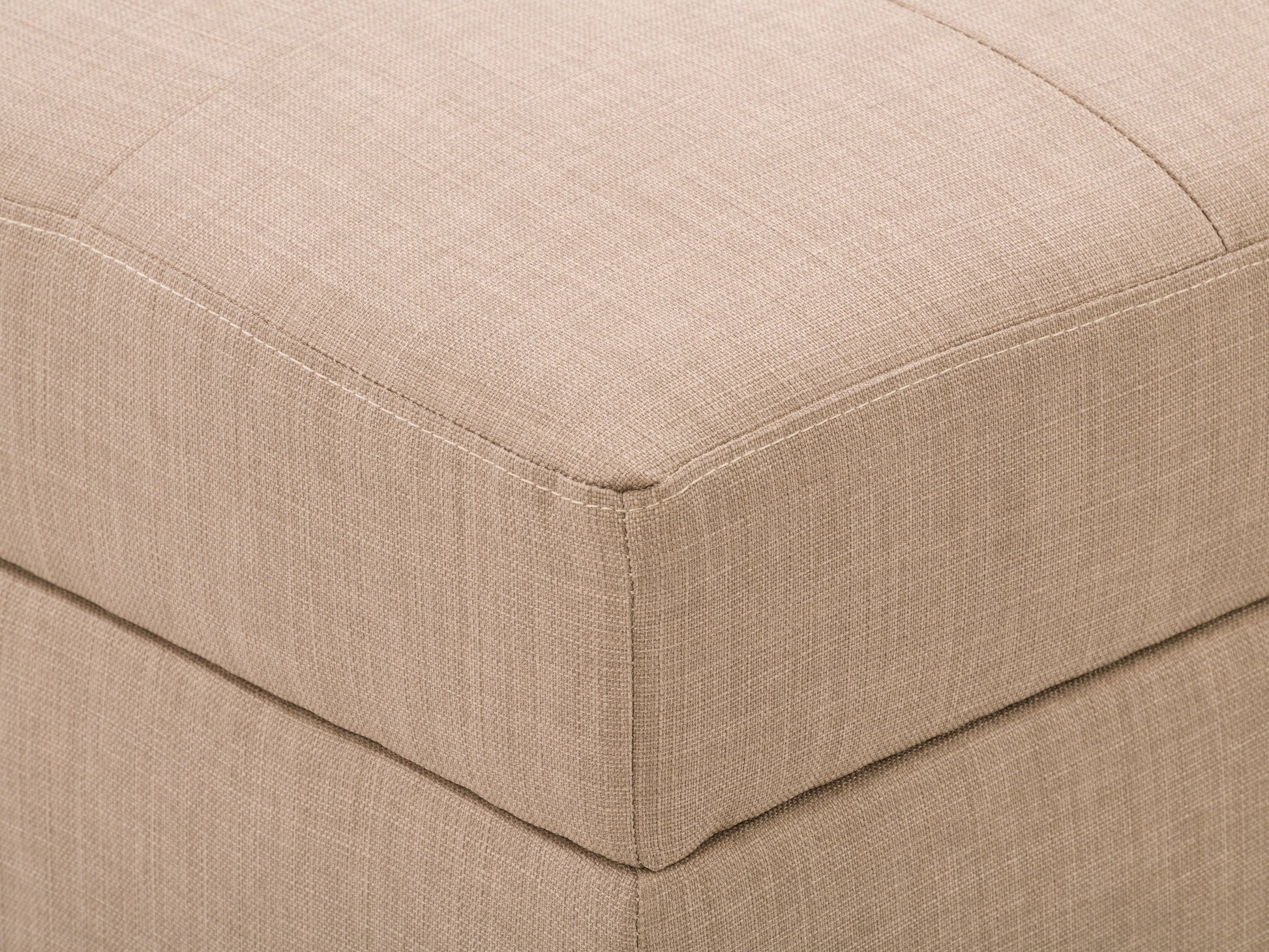 Tufted storage ottoman in light grey fabric with button-tufted top, wooden legs in dark finish, and hidden compartment for storage. Ideal for living room seating and organization.