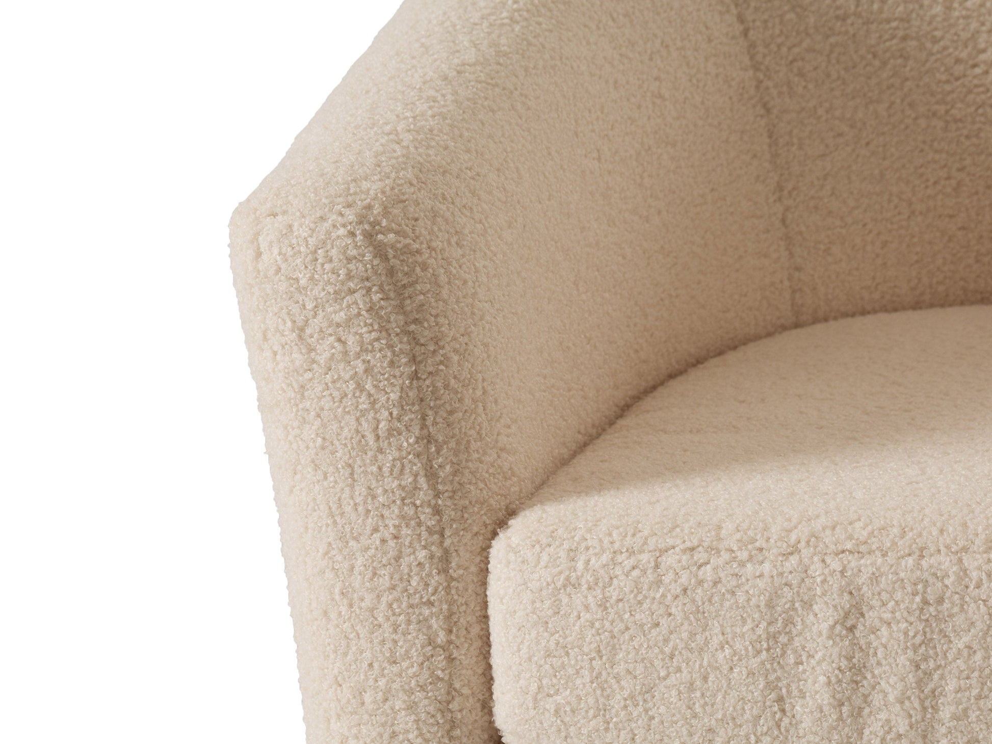 Cream boucle barrel accent chair with curved backrest, plush texture, and wooden legs. Chair features a modern design, perfect for living rooms or reading nooks.