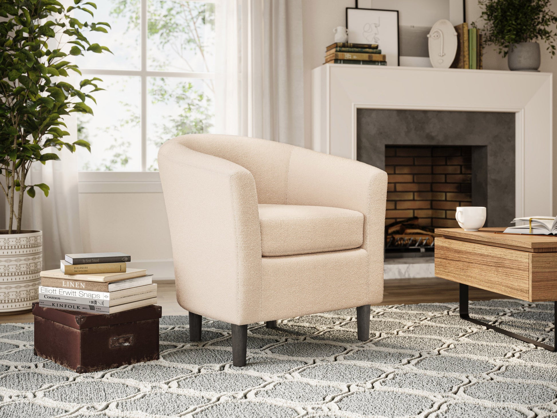 Cream boucle barrel accent chair with curved backrest, plush texture, and wooden legs. Chair features a modern design, perfect for living rooms or reading nooks.