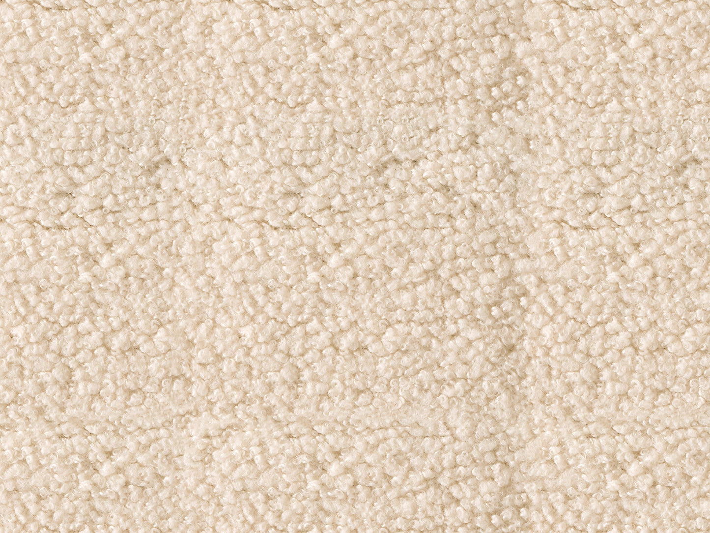 Cream boucle barrel accent chair with curved backrest, plush texture, and wooden legs. Chair features a modern design, perfect for living rooms or reading nooks.