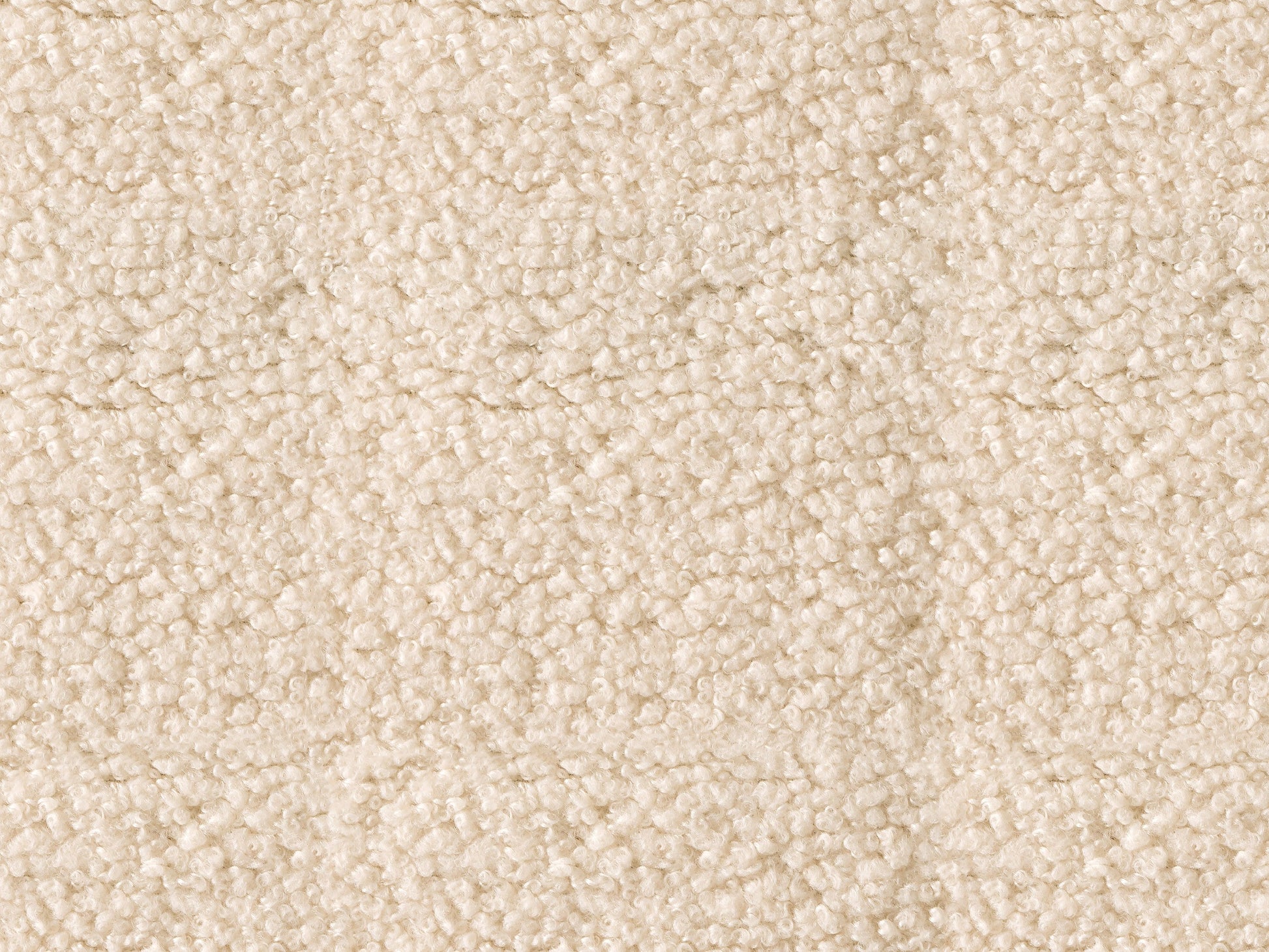 Cream boucle barrel accent chair with curved backrest, plush texture, and wooden legs. Chair features a modern design, perfect for living rooms or reading nooks.