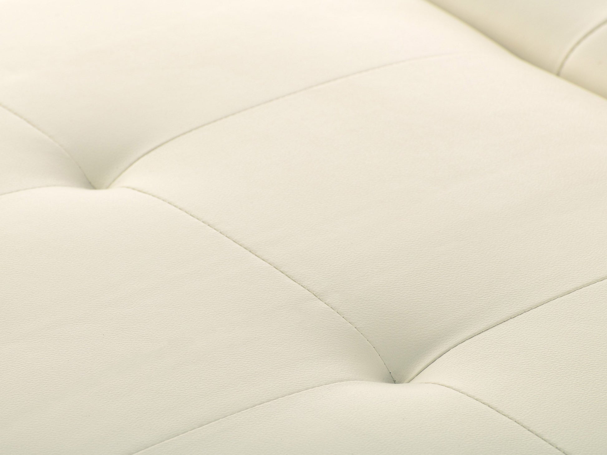 Warm white deluxe storage ottoman with tufted top, soft fabric, and wooden legs. Features spacious interior storage and versatile design, perfect for living rooms or bedrooms.