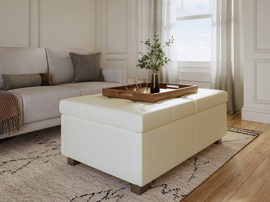 Warm white deluxe storage ottoman with tufted top, soft fabric, and wooden legs. Features spacious interior storage and versatile design, perfect for living rooms or bedrooms.