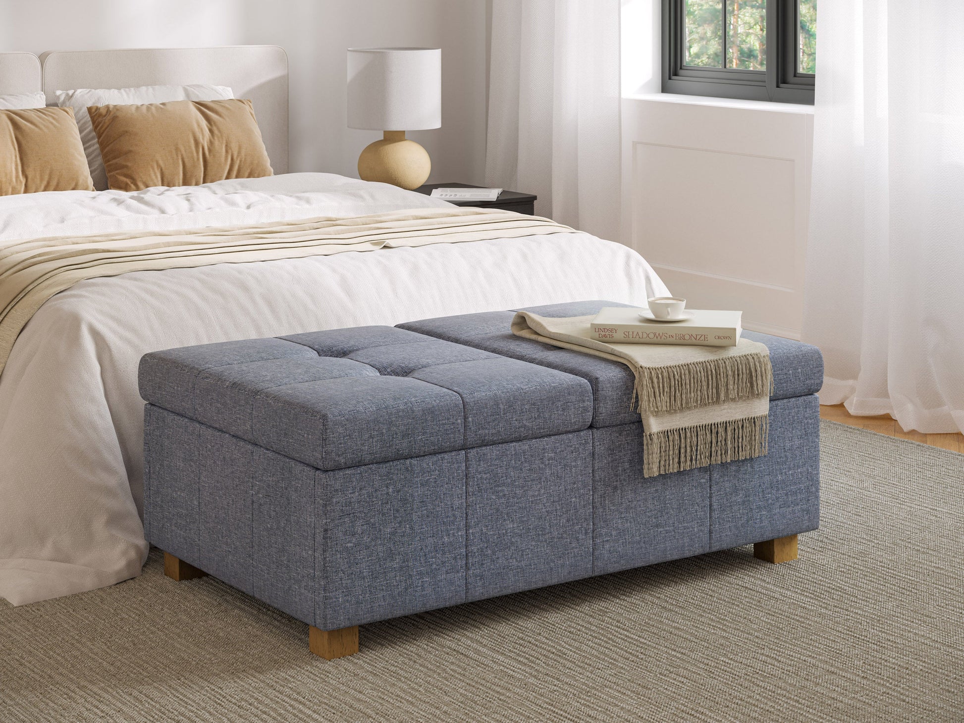 Grey double storage ottoman with tufted top, soft fabric upholstery, and sturdy wooden legs, ideal for living room organization and extra seating.