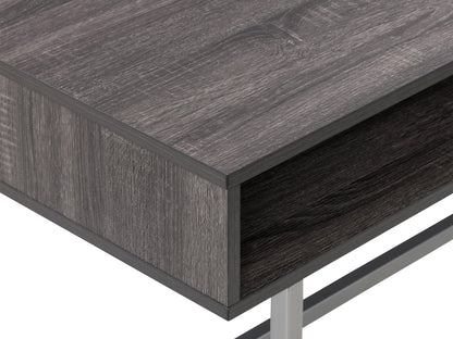 Modern rectangular coffee table in grey with a sleek, minimalist design featuring a smooth, matte finish, sturdy metal legs, and a spacious surface perfect for living rooms or offices.