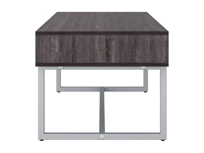 Modern rectangular coffee table in grey with a sleek, minimalist design featuring a smooth, matte finish, sturdy metal legs, and a spacious surface perfect for living rooms or offices.