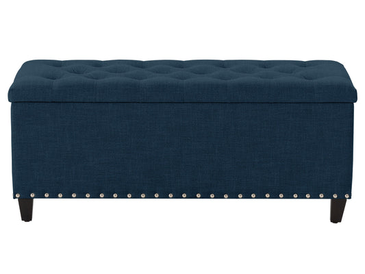 Navy blue tufted storage ottoman with soft velvet fabric, wooden legs, and spacious interior compartment for living room or bedroom.