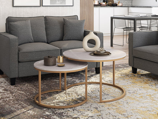Round nesting coffee tables with white marble tops and gold metal frames, featuring a modern design and space-saving functionality. Perfect for contemporary living rooms seeking stylish, luxurious accents.