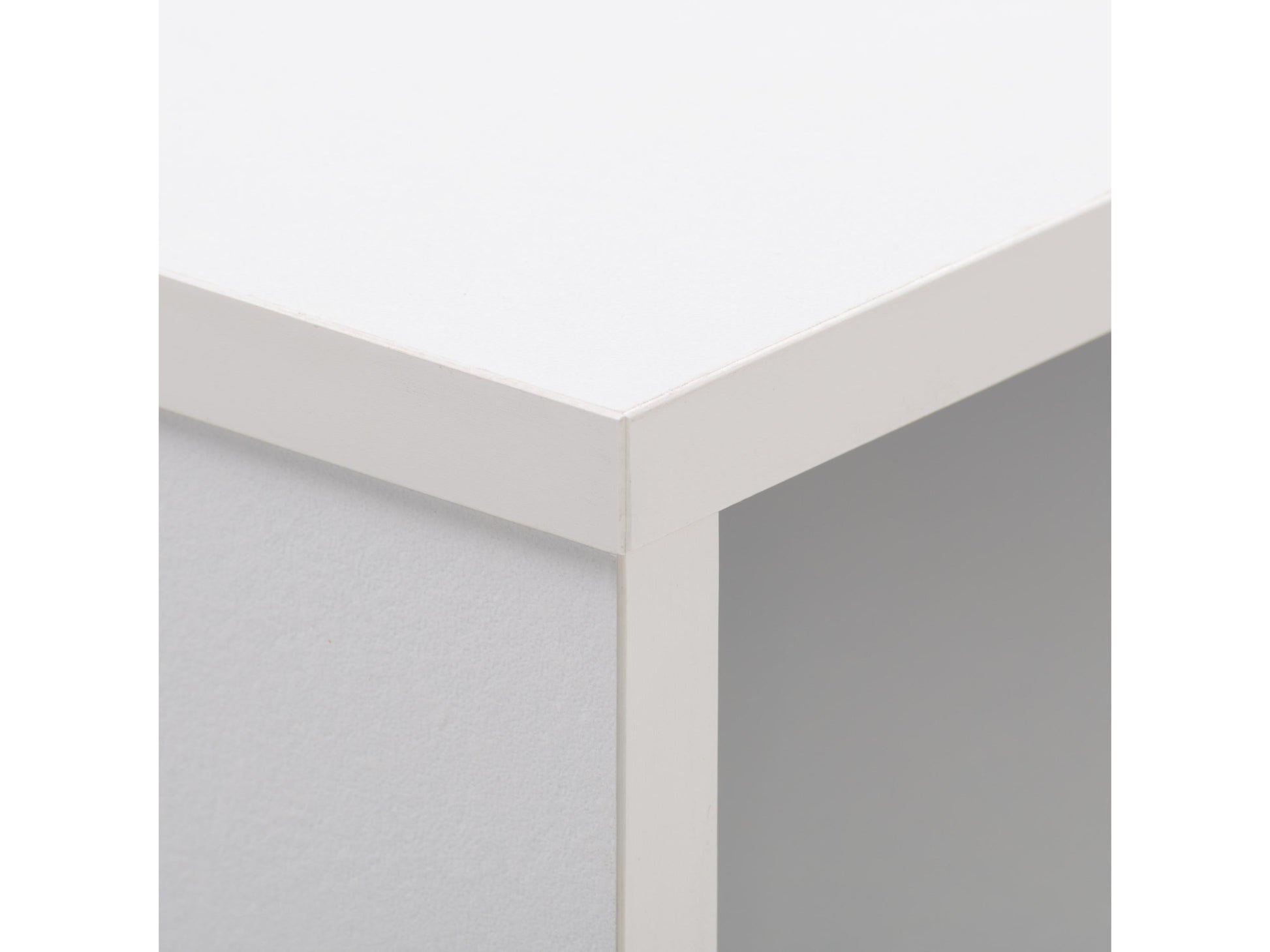White and black mid-century modern desk with sleek lines, wooden legs, and minimalist design, featuring a smooth white top and black drawer for storage, perfect for home office or study.