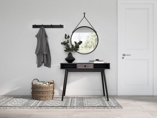 Mid-century black desk with sleek lines, wooden legs, and a smooth matte finish. Features two spacious drawers with minimalist handles, ideal for modern home offices or study spaces.