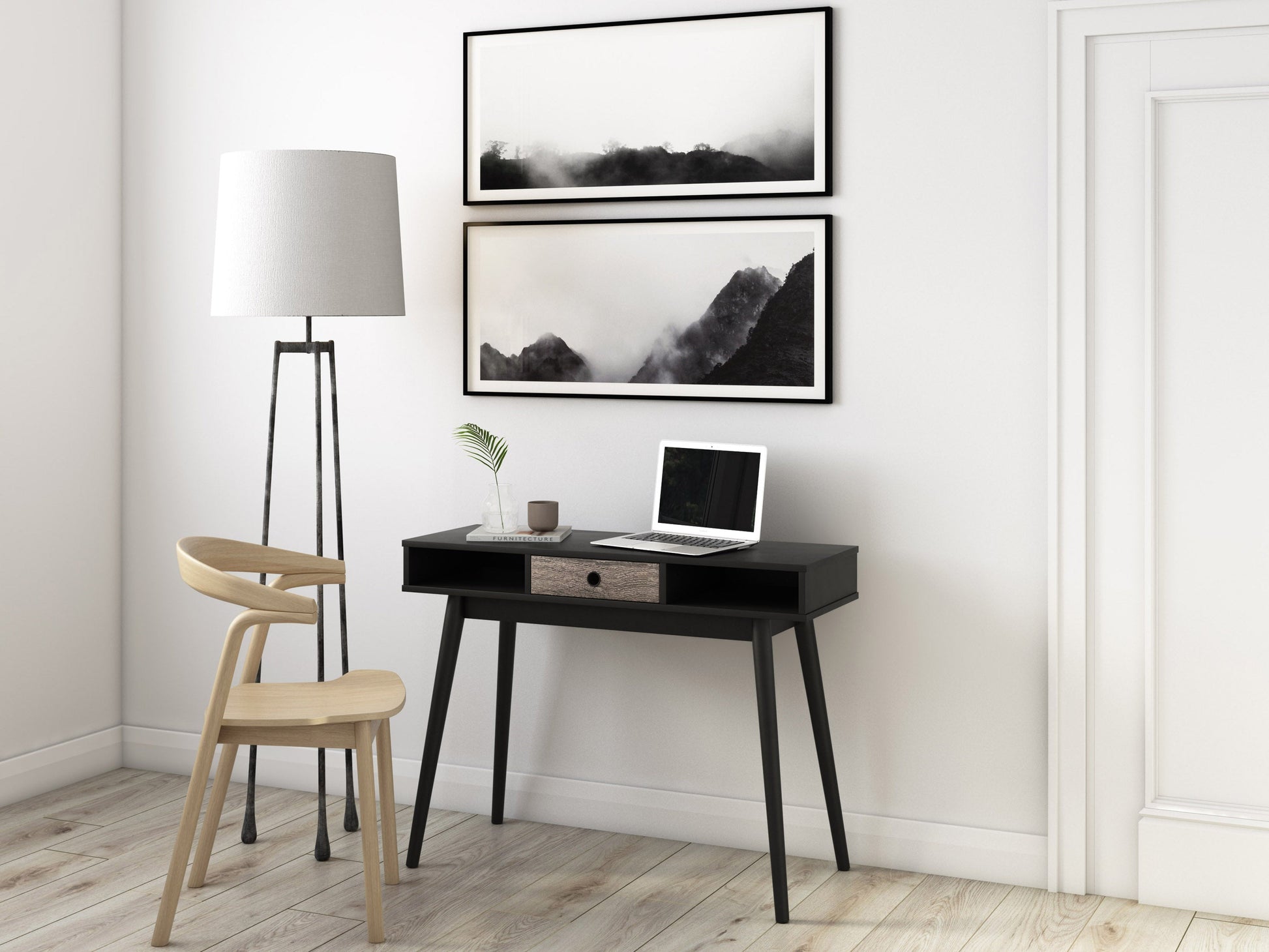 Mid-century black desk with sleek lines, wooden legs, and a smooth matte finish. Features two spacious drawers with minimalist handles, ideal for modern home offices or study spaces.