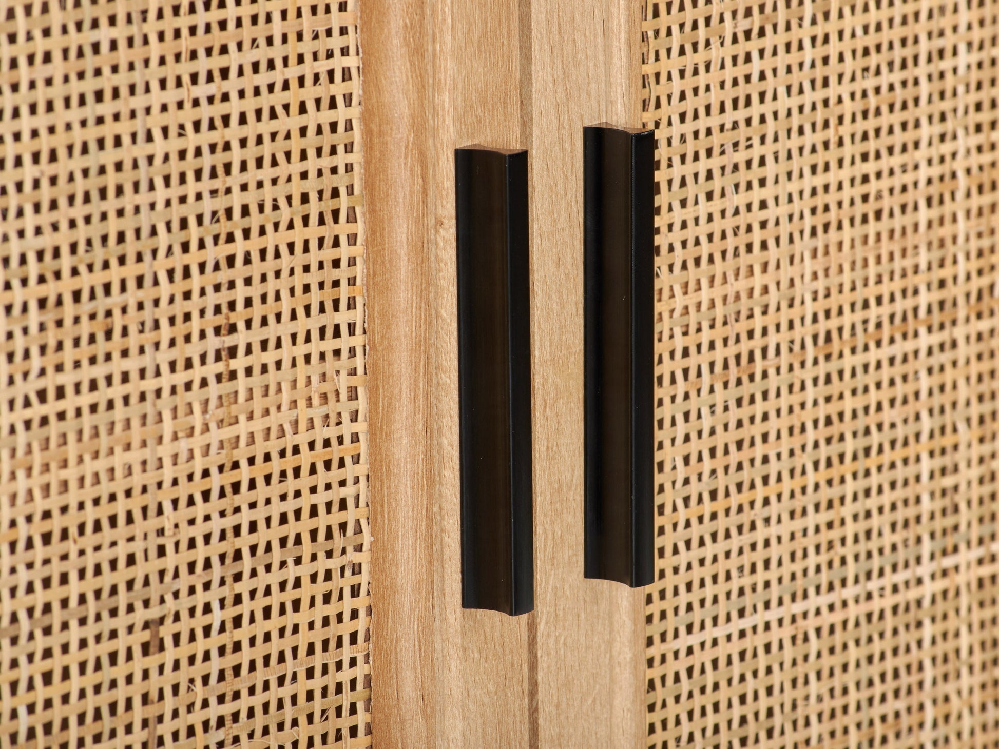 Light wood dining cabinet with clean lines, two doors, and minimalist metal handles. Features a natural finish with subtle wood grain texture, perfect for modern or Scandinavian interiors.