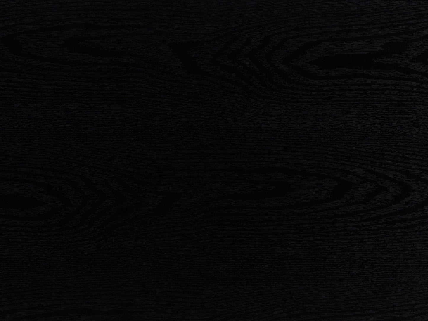Black fluted coffee table with sleek round design, made of durable wood, featuring a textured fluted base and smooth top surface, perfect for modern living rooms or minimalist decor.