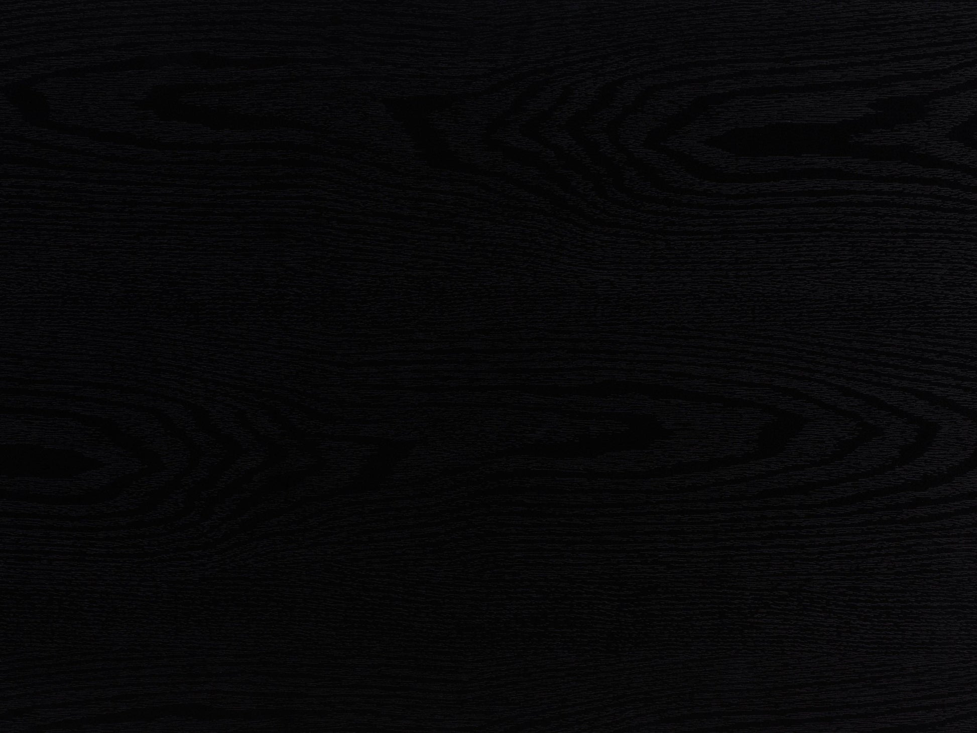 Black fluted coffee table with sleek round design, made of durable wood, featuring a textured fluted base and smooth top surface, perfect for modern living rooms or minimalist decor.