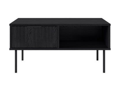 Black fluted coffee table with sleek round design, made of durable wood, featuring a textured fluted base and smooth top surface, perfect for modern living rooms or minimalist decor.