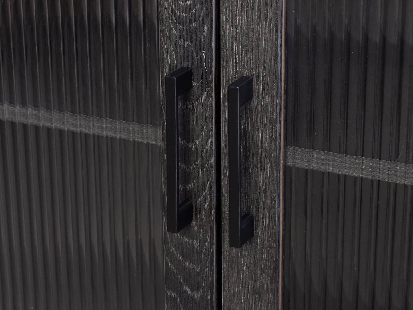 Fluted glass sideboard with black metal frame, featuring ribbed glass doors, sleek handles, and a modern design.
