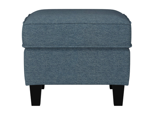 Blue fabric ottoman with tufted top, wooden legs, and storage compartment, perfect for living room or bedroom decor.