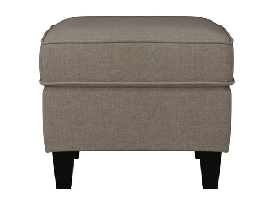 Taupe fabric ottoman with soft, textured upholstery and sturdy wooden legs, perfect for living room or bedroom decor. Ideal for extra seating or as a stylish footrest.