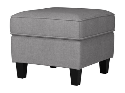 Light grey fabric ottoman with tufted top, wooden legs, and soft texture; ideal for living room seating or storage.