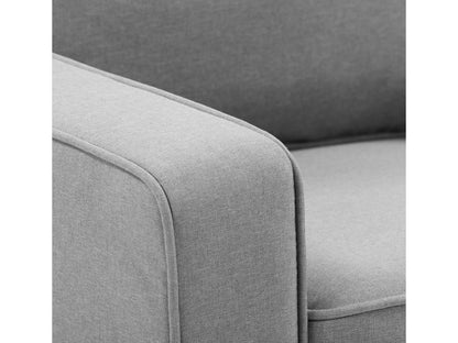 Light grey 3-seater sofa with plush cushions, wooden legs, and soft fabric upholstery. Ideal for modern living rooms, this stylish couch offers comfort and elegance, perfect for family gatherings or relaxation.