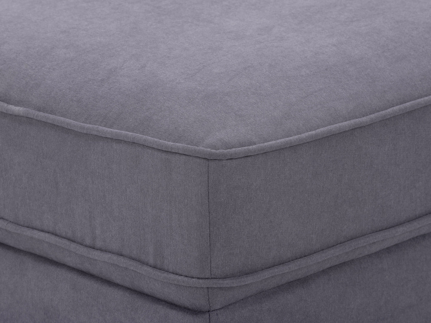Grey mid-century modern ottoman with wooden legs, upholstered in soft fabric. Features a minimalist design with tufted top cushion and sturdy construction, perfect for living room or office decor.