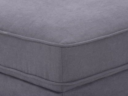 Grey mid-century modern ottoman with wooden legs, upholstered in soft fabric. Features a minimalist design with tufted top cushion and sturdy construction, perfect for living room or office decor.