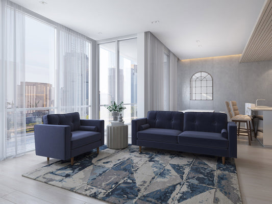 Navy blue sofa and chair set with plush cushions, wooden legs, and soft velvet upholstery, ideal for modern living rooms.