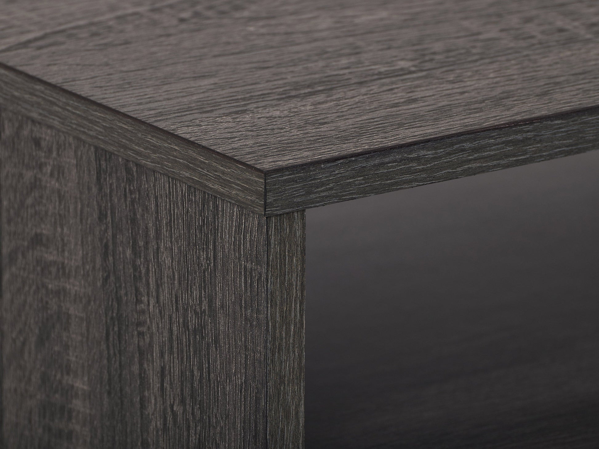 Dark grey rectangle coffee table with storage shelf, featuring a sleek wooden finish and minimalist design. Ideal for modern living rooms, providing ample space for books, decor, and essentials.