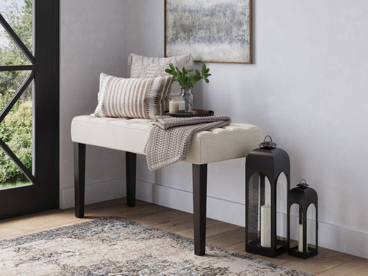 White leather bench with sleek design, polished chrome legs, and tufted cushion. Ideal for modern living rooms or entryways. Durable and stylish, perfect for contemporary home decor.