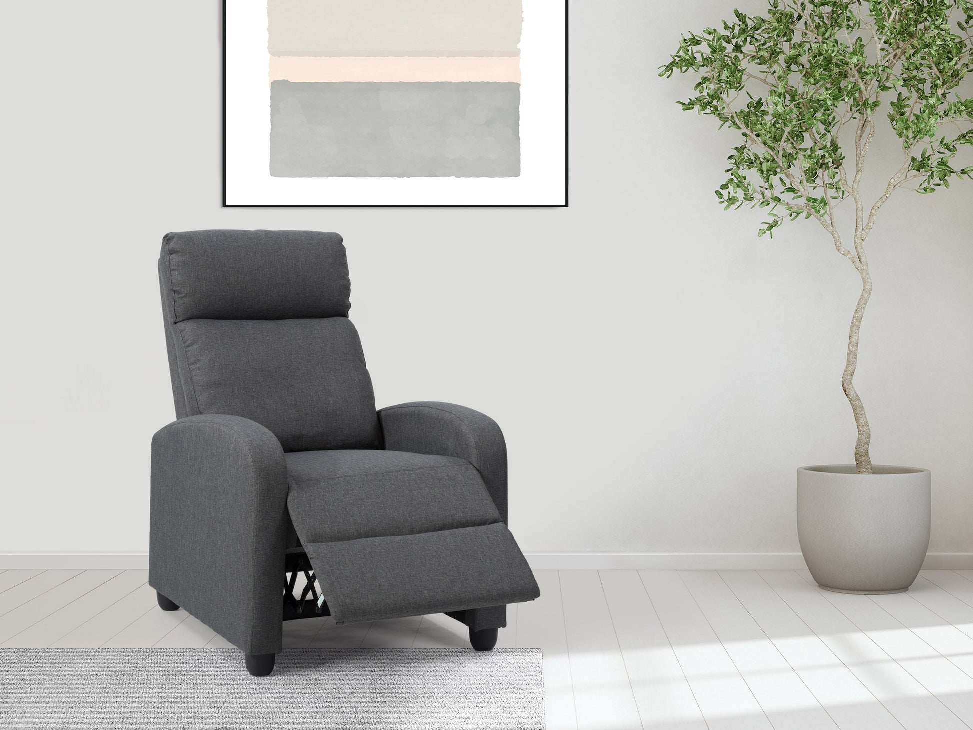 Dark grey push back recliner with plush cushioning, sleek armrests, and durable fabric upholstery. Ideal for living rooms, this comfortable and stylish chair features a reclining mechanism for ultimate relaxation.