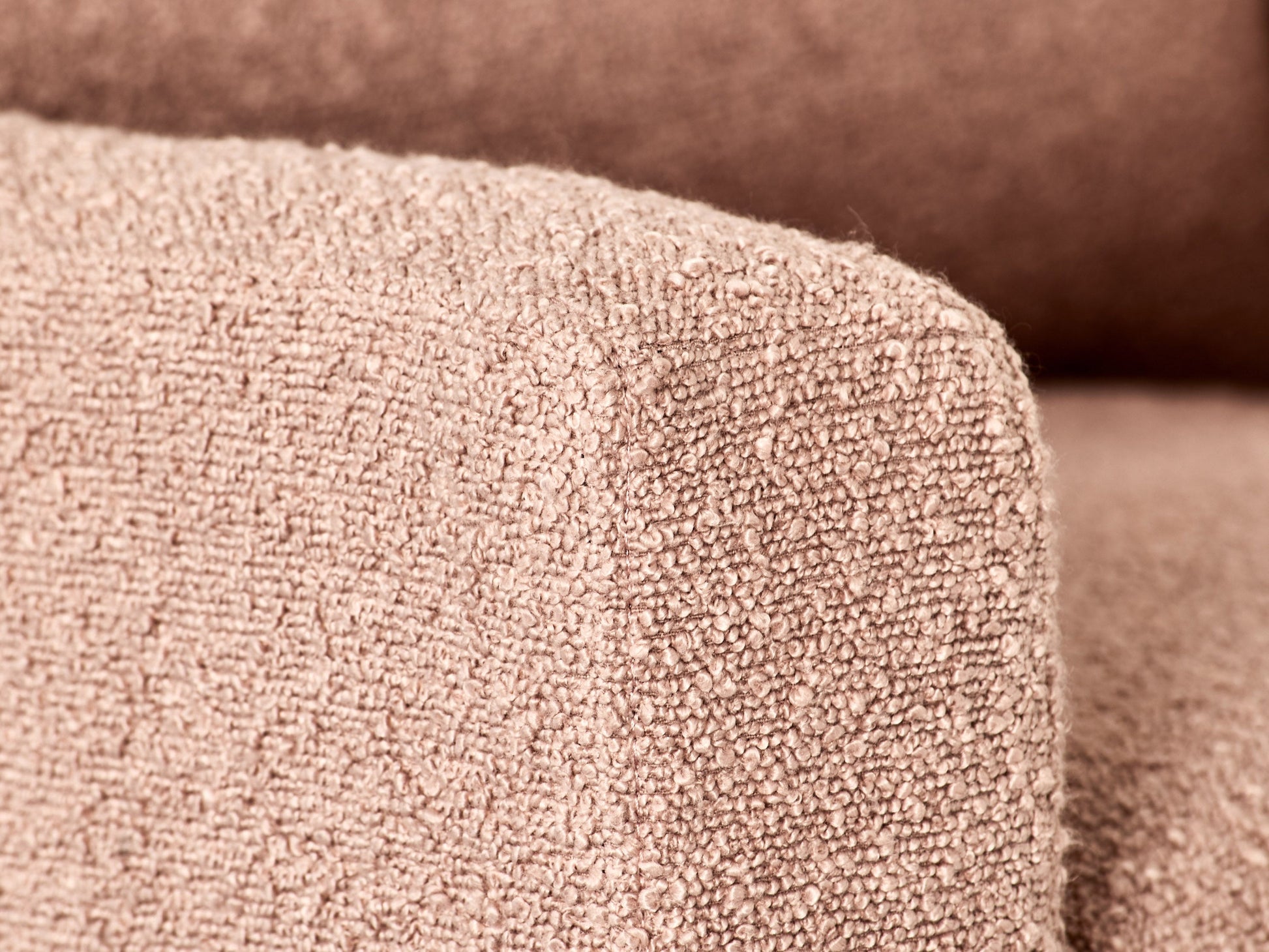 Pink boucle glider recliner chair with plush upholstery, smooth gliding mechanism, and ergonomic design. Ideal for modern living rooms or nurseries.