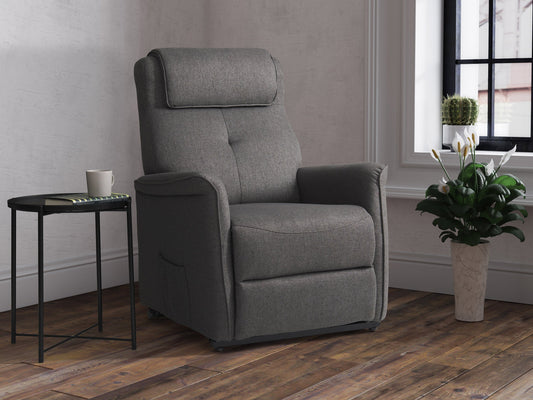 Medium grey power lift recliner with plush upholstery, ergonomic design, padded armrests, and remote control for easy adjustment. Ideal for elderly or mobility-challenged users seeking comfort and convenience.