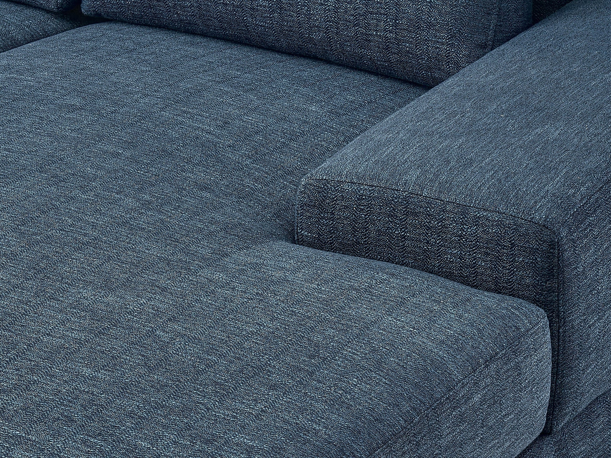 Modern blue sectional sofa, right-facing with plush cushions, sleek lines, and a durable fabric finish, perfect for contemporary living rooms. Features include adjustable headrests and stainless steel legs for added style and support.
