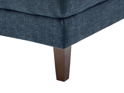 Modern blue sectional sofa, right-facing with plush cushions, sleek lines, and a durable fabric finish, perfect for contemporary living rooms. Features include adjustable headrests and stainless steel legs for added style and support.