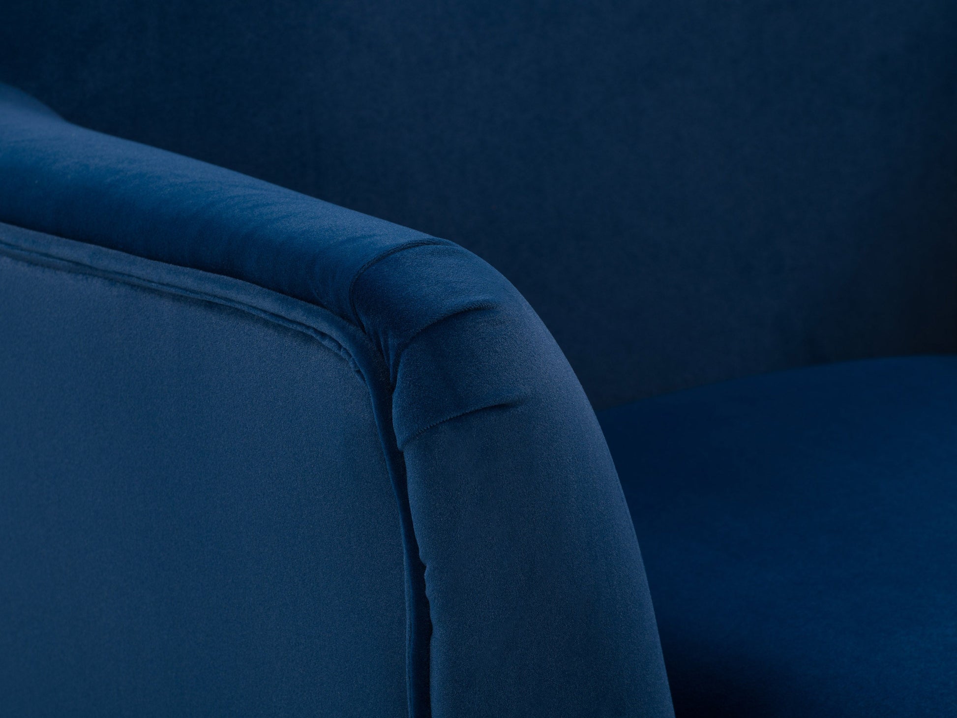 Blue modern wingback accent chair with tufted backrest, wooden legs, and soft velvet upholstery, perfect for living room or bedroom decor.