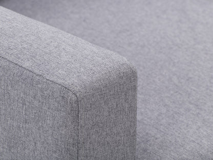 Grey tufted accent chair with wooden legs, featuring soft fabric upholstery, button-tufted backrest, and cushioned seat for comfort. Ideal for living rooms or reading nooks.
