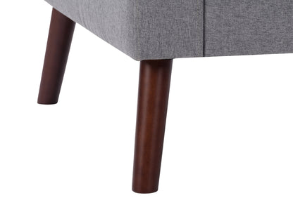 Grey tufted accent chair with wooden legs, featuring soft fabric upholstery, button-tufted backrest, and cushioned seat for comfort. Ideal for living rooms or reading nooks.