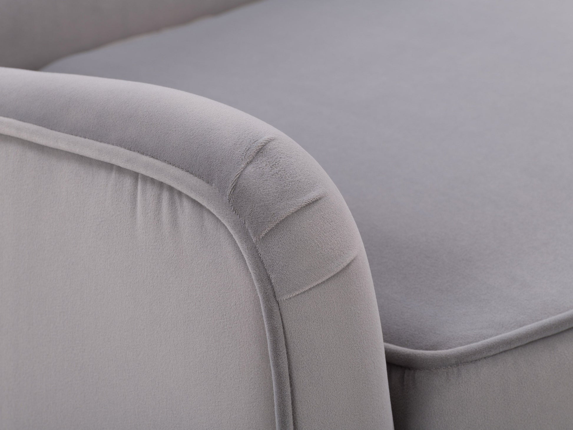 Elegant grey velvet accent chair with plush cushioning, sleek gold metal legs, and tufted backrest. Ideal for modern living rooms or offices, this stylish chair offers both comfort and sophistication.