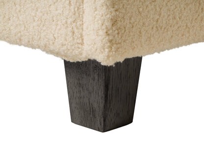 Cream boucle storage ottoman with soft, textured fabric, featuring a lift-top lid for hidden storage, wooden legs in natural finish, and a minimalist design perfect for modern living rooms or bedrooms.