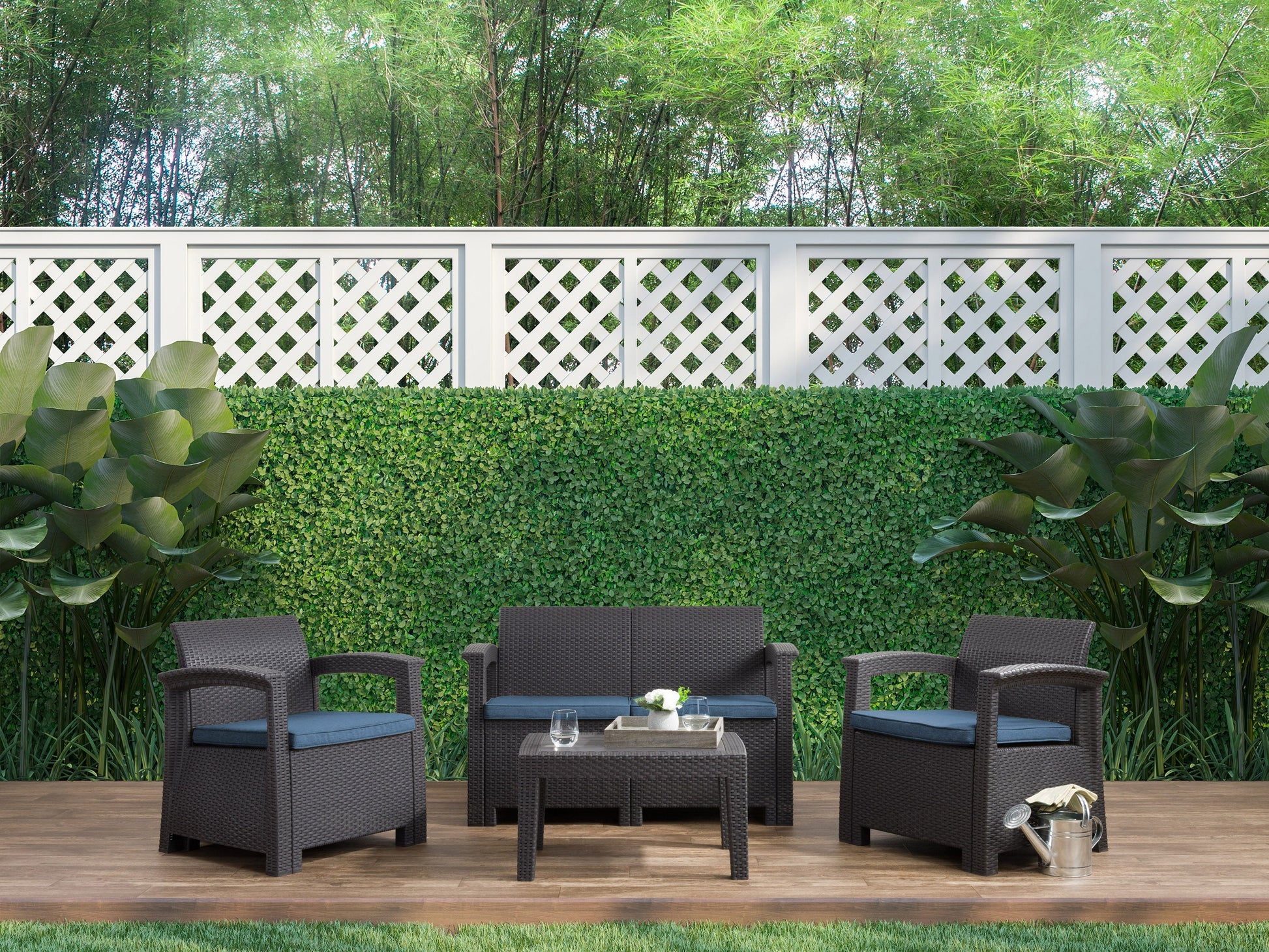 Blue 4-piece patio conversation set with cushioned seats, rattan wicker frame, glass-top coffee table, and weather-resistant materials, ideal for outdoor lounging and entertaining.