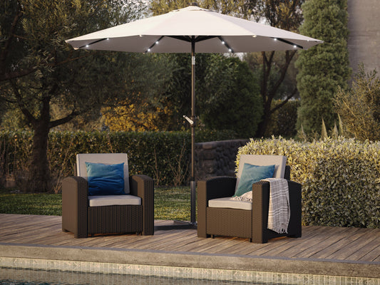 Off-white 9ft patio umbrella with tilting feature and built-in LED lights, providing shade and ambiance for outdoor spaces, featuring a sturdy metal pole and weather-resistant fabric.