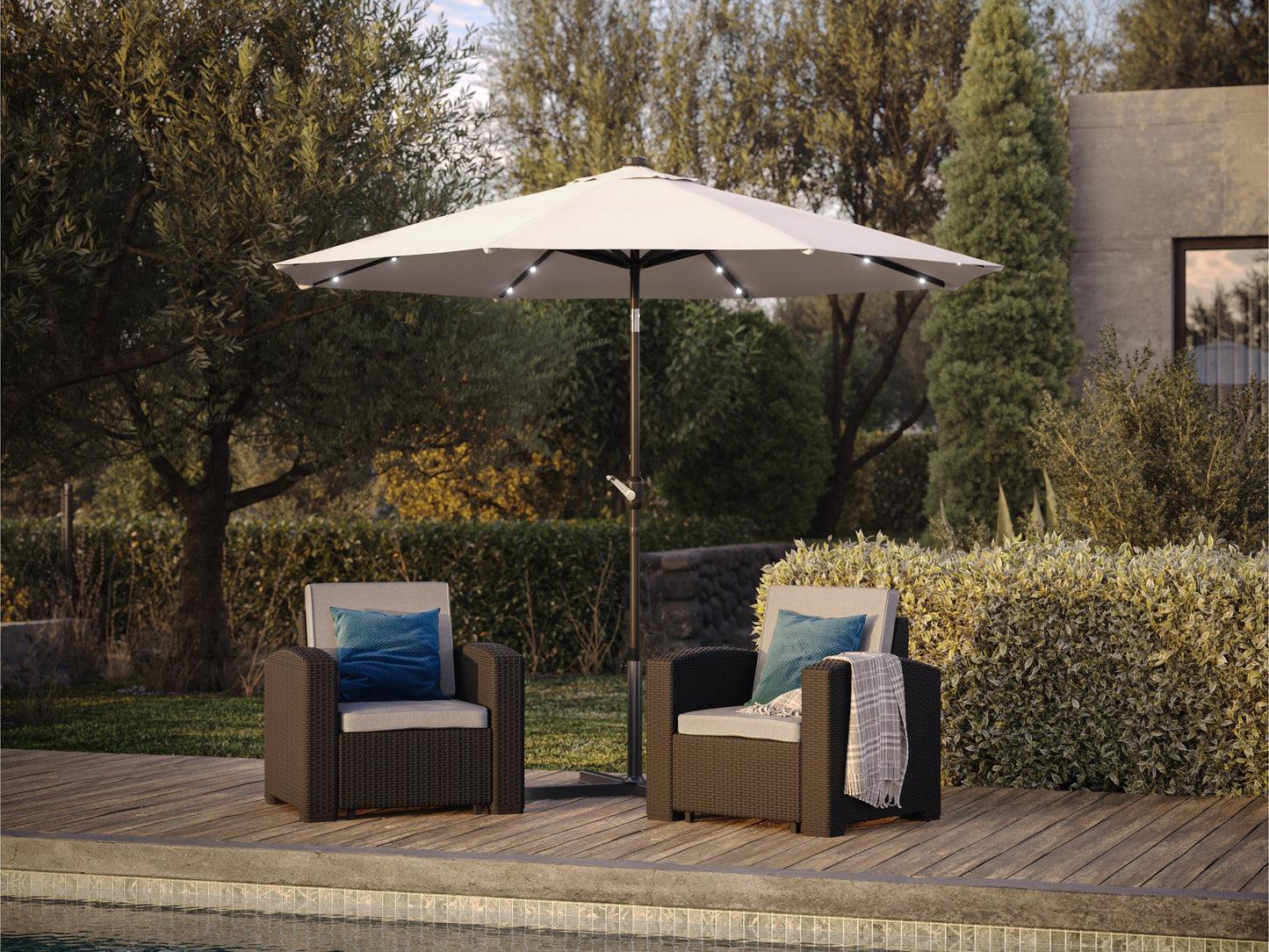 Off-white 9ft patio umbrella with tilting feature and built-in LED lights, providing shade and ambiance for outdoor spaces, featuring a sturdy metal pole and weather-resistant fabric.