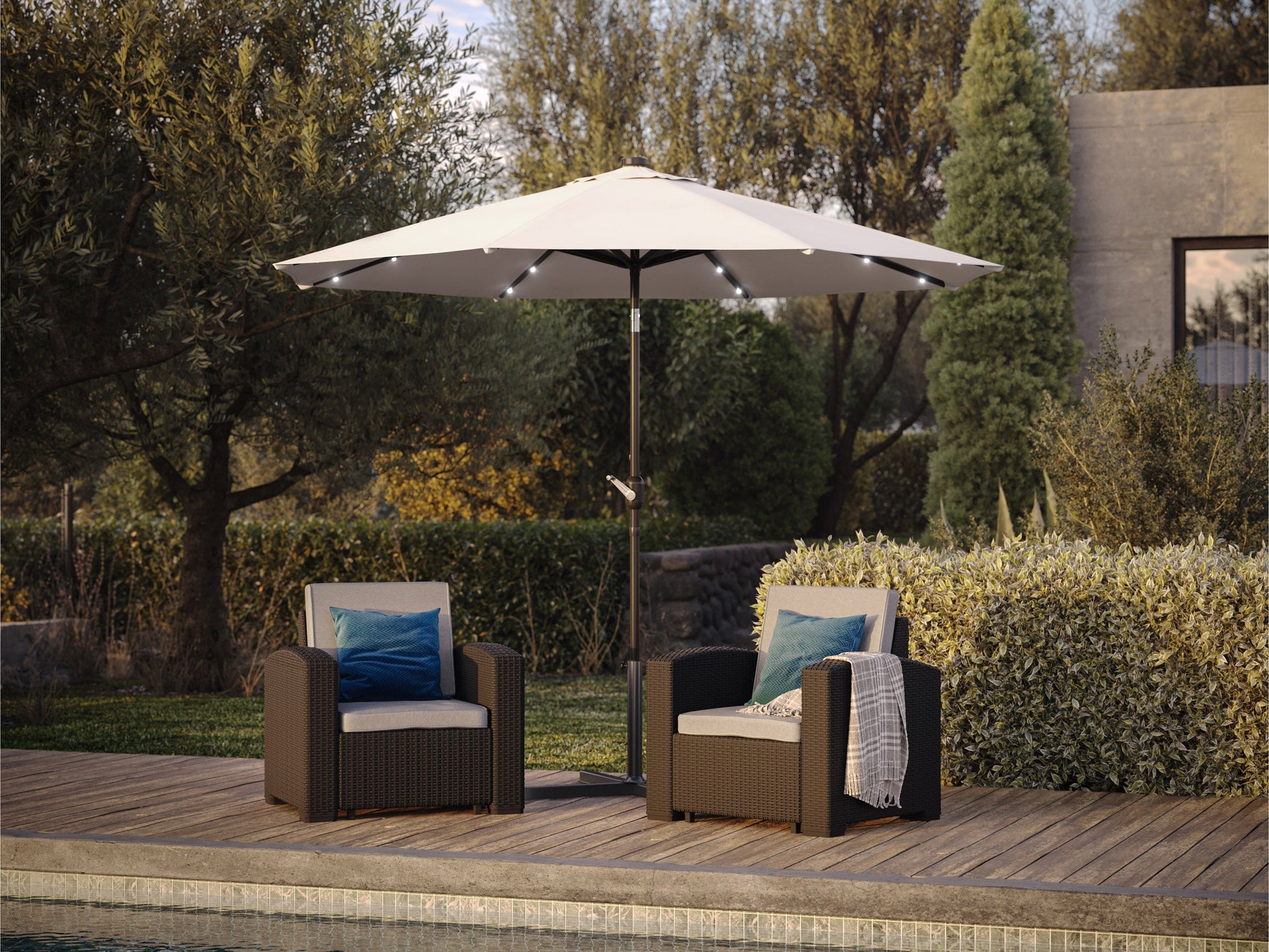 Off-white 9ft patio umbrella with tilting feature and built-in LED lights, providing shade and ambiance for outdoor spaces, featuring a sturdy metal pole and weather-resistant fabric.