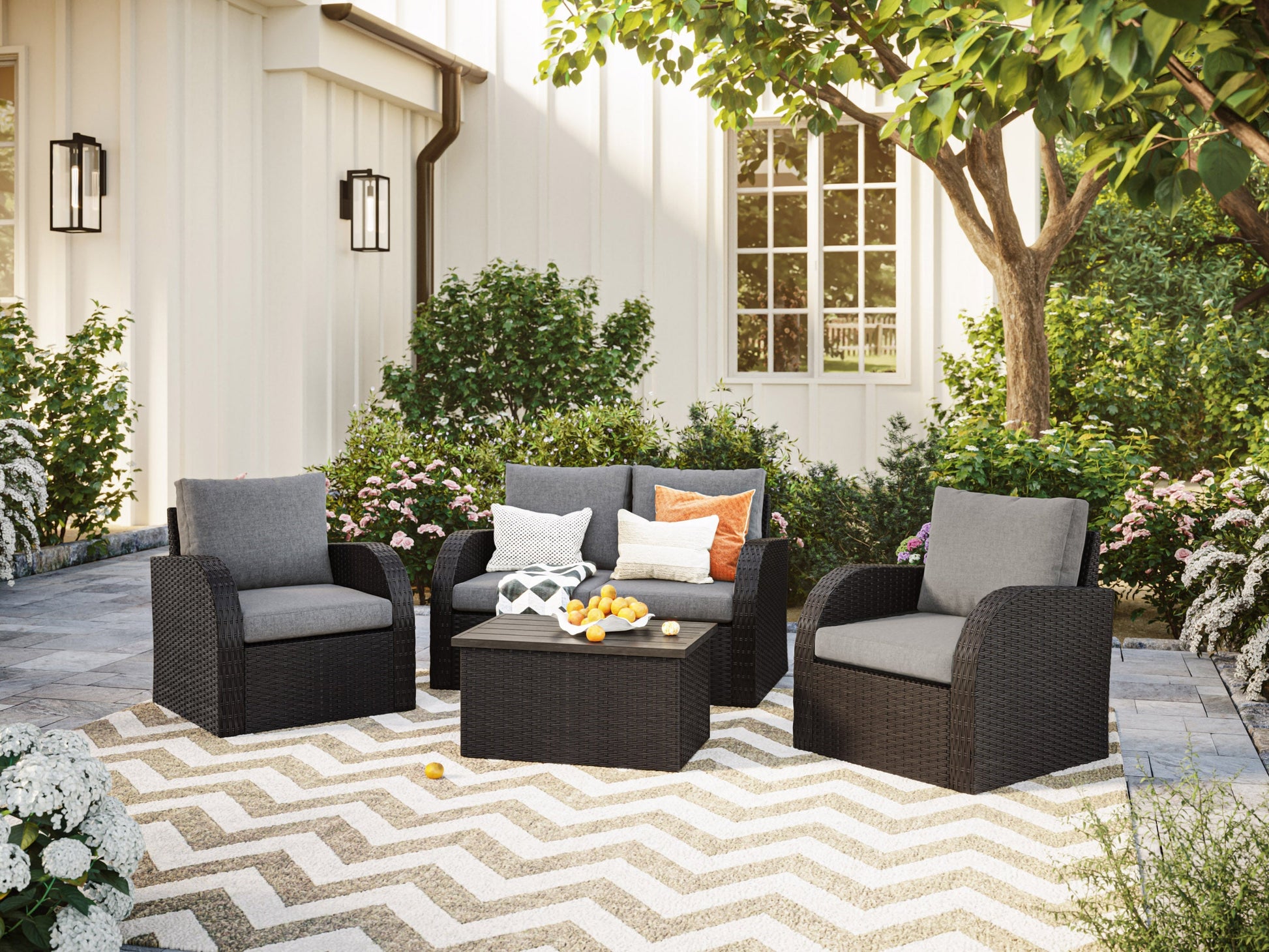 Grey outdoor loveseat set with cushions, featuring a modern design, durable wicker frame, and tempered glass coffee table, perfect for patio or garden lounging. Includes two chairs, loveseat, and side table.
