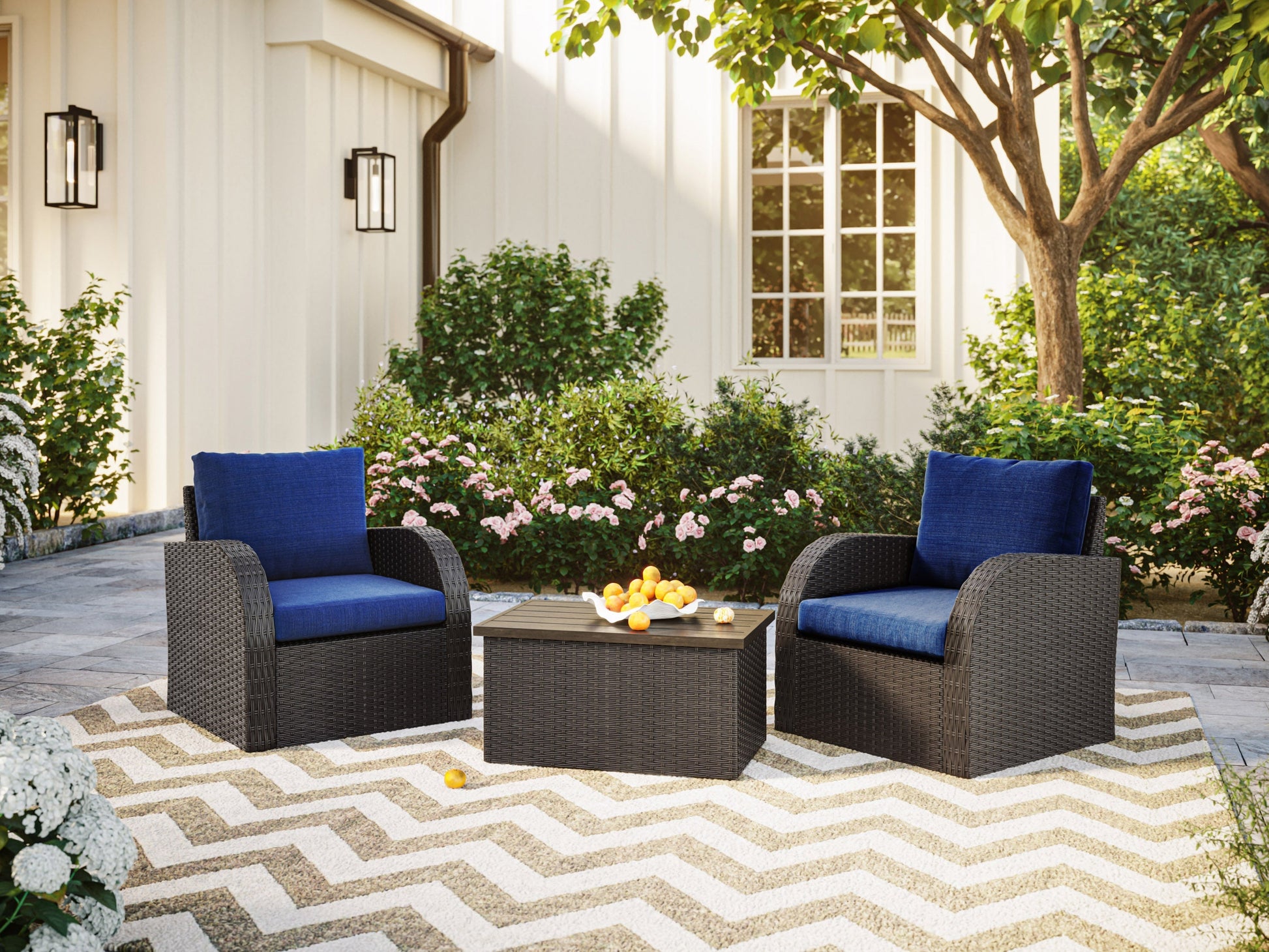 Alt text: "Outdoor wicker patio conversation set with a blue table and chairs, featuring durable rattan material and comfortable cushions, perfect for garden or backyard relaxation."