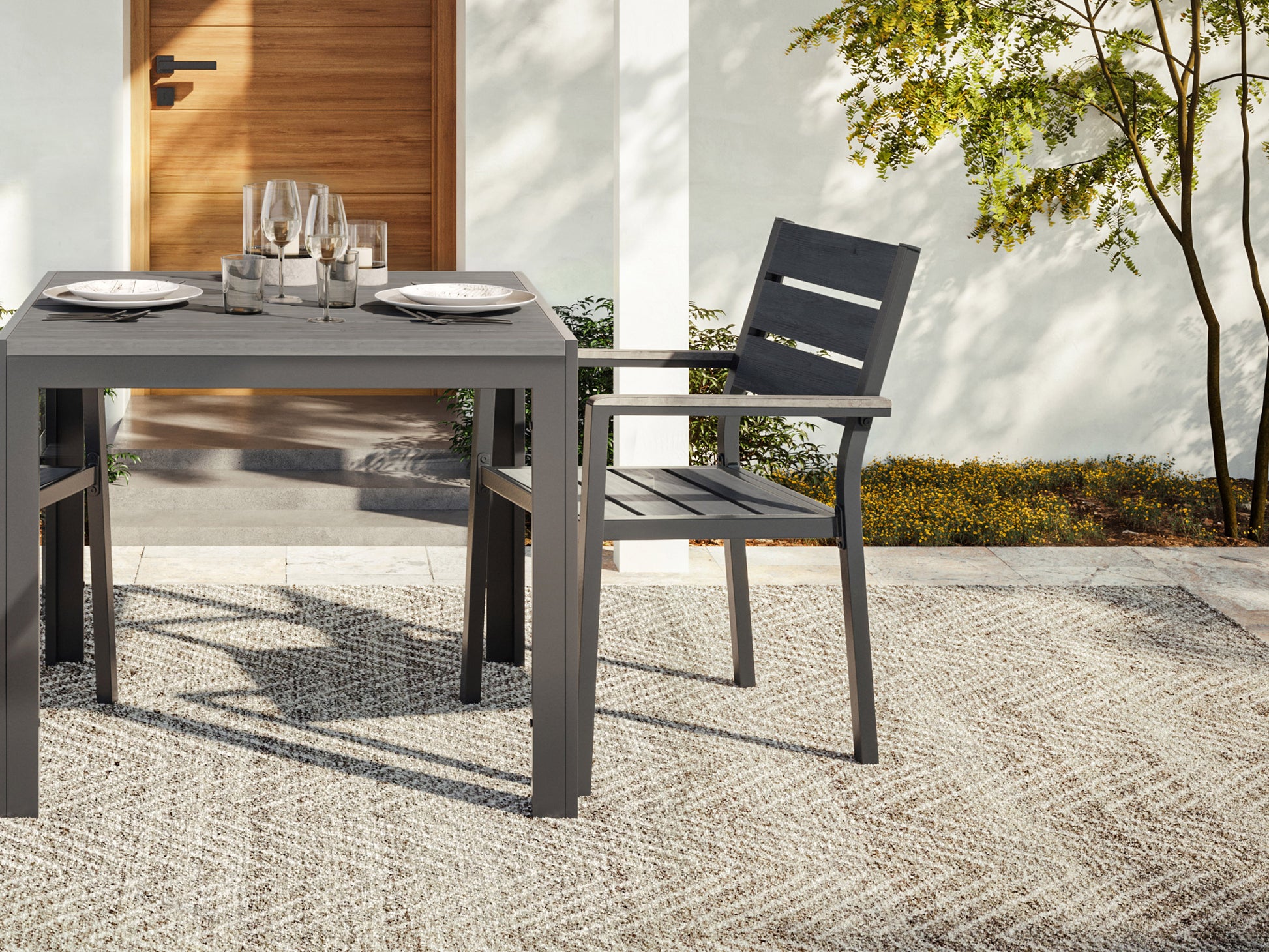 Set of 2 patio dining chairs with weather-resistant wicker, featuring beige cushions and a sturdy metal frame, perfect for outdoor dining.