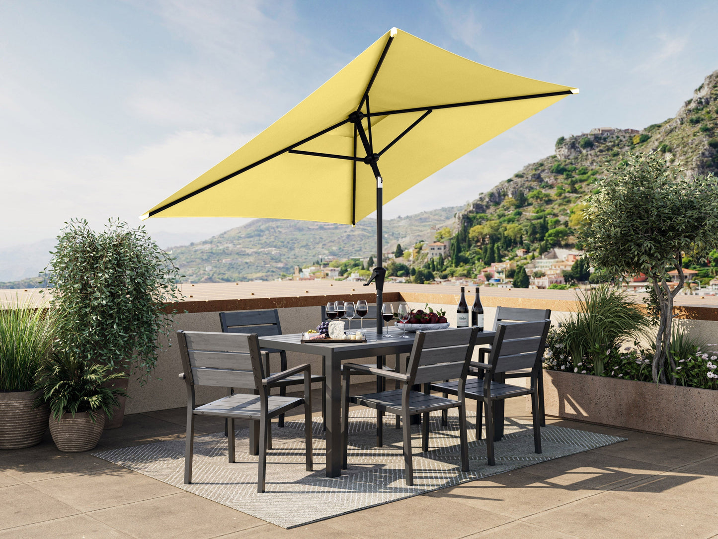 Yellow 9ft square patio umbrella with tilting feature, durable aluminum frame, and weather-resistant fabric, perfect for outdoor seating areas and providing ample shade.